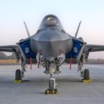 Front view of a fighter jet at an air show in Bengaluru, India, showcasing advanced military technology.