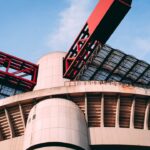 a large building with a large red object on top of it