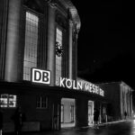 a black and white photo of a building at night