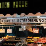 a fruit stand with various fruits and vegetables