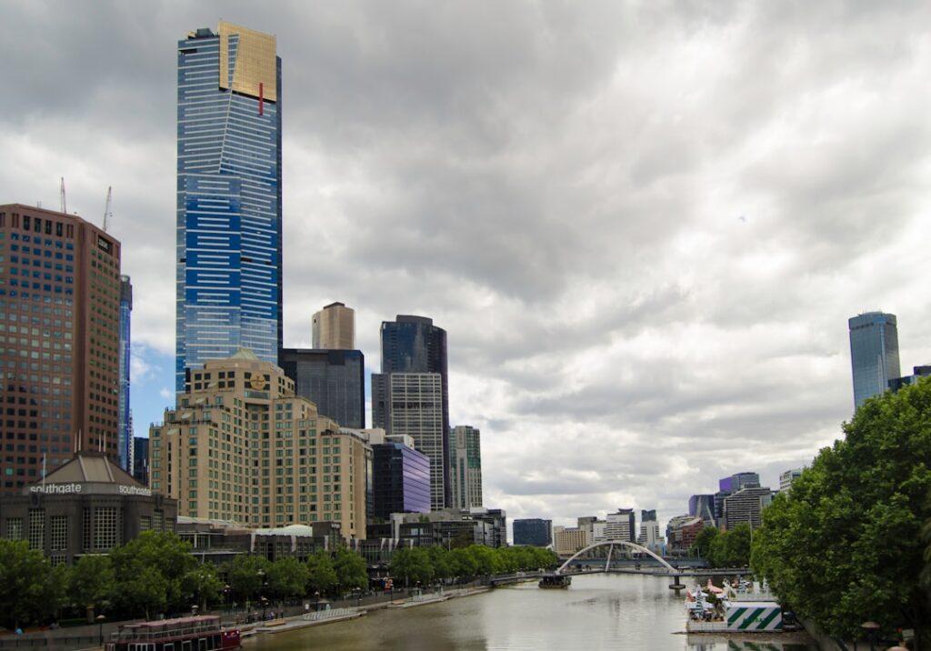 A river running through a city next to tall buildings