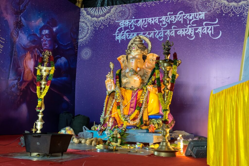A statue of lord ganesh in front of a stage