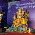 A statue of lord ganesh in front of a stage