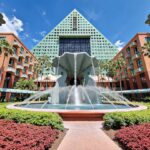 water fountain in front of brown building