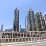 A group of tall buildings sitting next to each other