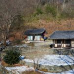 A couple of buildings sitting on top of a snow covered ground