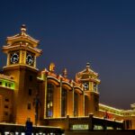 a large building with a clock tower in front of it