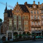 Ornate buildings stand against a blue sky.