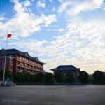 a large building with a flag on top of it