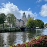 a body of water with a building in the background