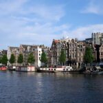 A body of water filled with lots of buildings