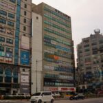 a street with cars and buildings on either side of it