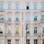 a tall building with many windows and balconies