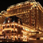 Spectacular night shot of the Parisian Macao Hotel, beautifully illuminated.