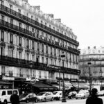Classic street scene of Paris featuring the iconic Terminus Nord building.