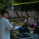 Dj playing music for an outdoor gathering