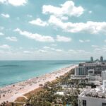 aerial photo of buildings beside beach