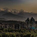 a city with mountains in the background