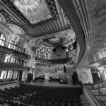 Ornate concert hall interior with stage and seating