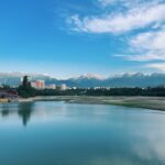a large body of water with a city in the background